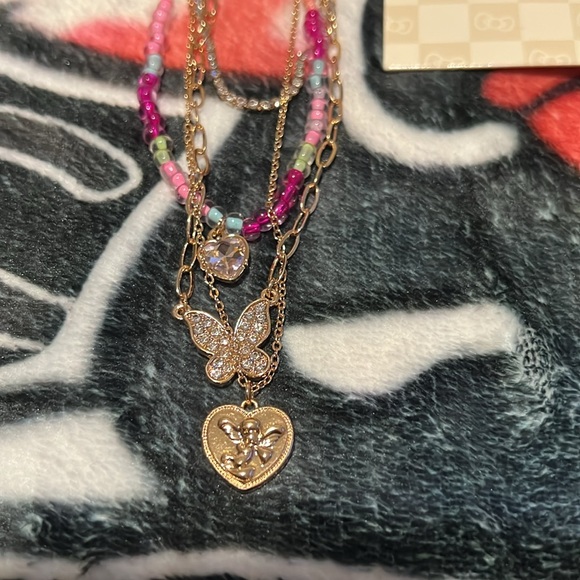 Hello kitty earring set and gold angel/butterfly necklace added! - Picture 2 of 5